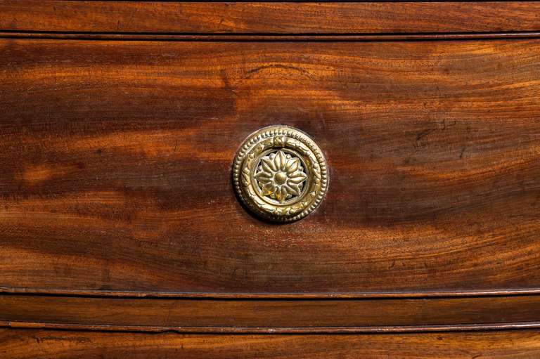 An elegant George III period mahogany Chest, beautifully figured timbers matching throughout, slender top with a molded edge, under the top two short and three long drawers, the whole standing on swept bracket feet.