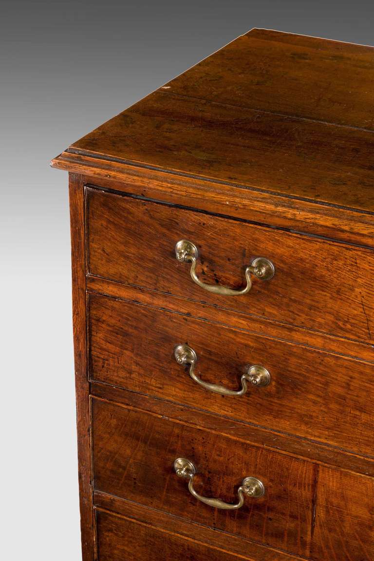 George III period oak straight fronted Chest of Drawers, the top two drawers made as a large single drawer with three drawers below, very good warm colour standing on original bracket feet.