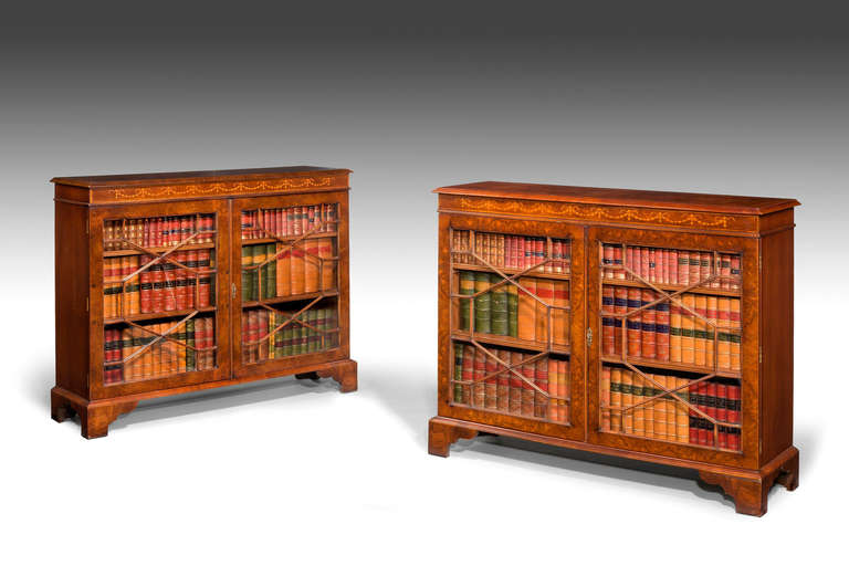 Pair of 19th century design mahogany Low Bookcases, the finely figured timbers with boxwood, swag and harebell decoration.