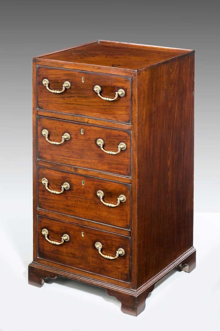 A rare George III period mahogany narrow chest with period swan neck handles, short bracket feet, with an inset top border.

RR