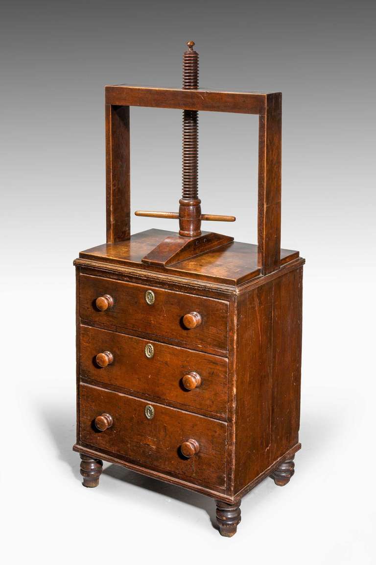 An unusual late George III period oak Clothes Press, good original surface and retaining period turned knobs.