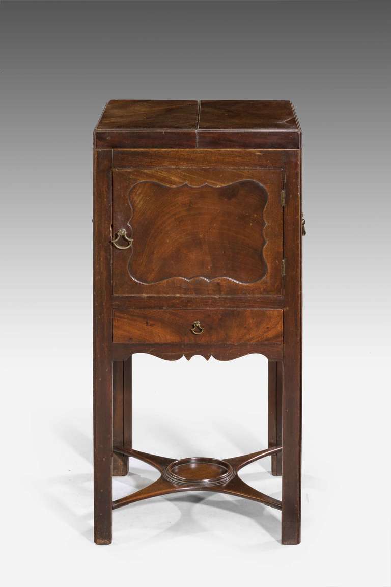 Chippendale period mahogany night cupboard and washstand incorporating an adjustable mirror, drawer and cupboard.

Makers Label to the reverse Tucker and Brathwaite Upholsters and Cabinet Makers Near Chancery Lane Holborn London. Retail and