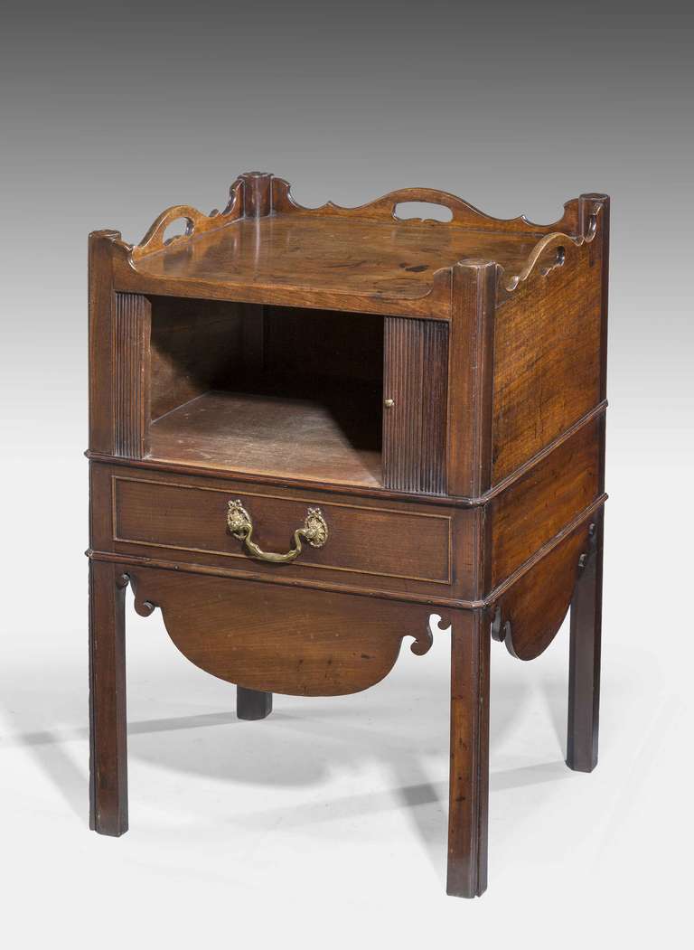 An attractive Chippendale period mahogany tambour fronted Night Cupboard, the top incorporating a wavy border on square chamfered supports, the commode section now closed with a blind drawer, excellent colour and patina.