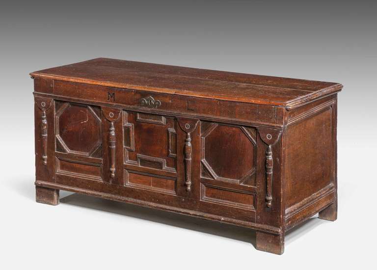 Late 17th century oak panelled Kist, the interior with a later candle box, excellent color and patina, inlaid with the initials 'ML'.

A Kist (also called coffer or chest) is one of the oldest forms of furniture. It is typically a rectangular