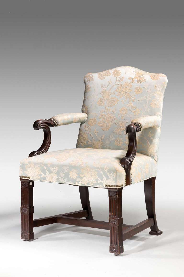 A substantial mahogany framed Library Chair of Chippendale influence with well carved blind fret supports, late 19th century.

