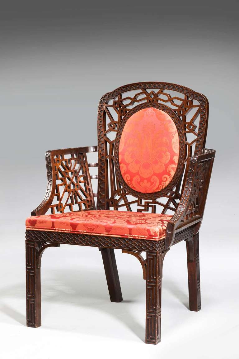 A finely carved mahogany Armchair, the design emanating from Thomas Chippendale's 'Chinese period,' fretted and blind fretted with elaborate carving.

RR.