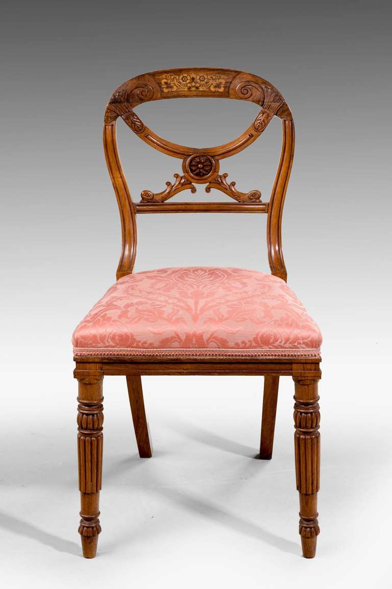 A fine late Regency period side chair,with turned supports under an elaborate wavy 'X' stretcher, the back with finely cut marquetry inlays and scrolls.

RR