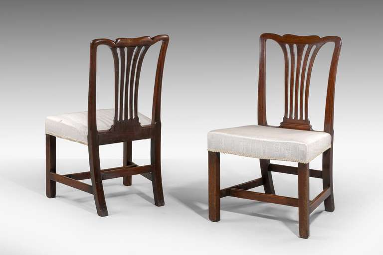 Pair of Chippendale period mahogany Side Chairs, of sturdy construction, the wavy top rail over a pierced central splat.

