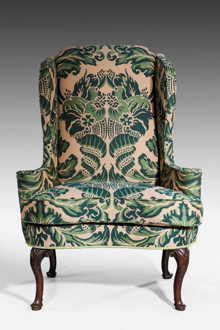 A good George II period cabriole leg wing chair of substantial size, on well carved supports terminating in pad feet. Also shown prior to re upholstery.

Provenance
An 18th or 19th century wing chair is an easy chair or club chair with 