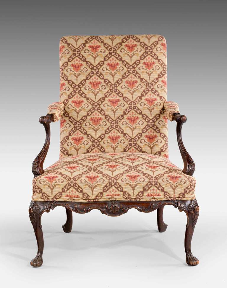 A late 19th century beech framed Gainsborough armchair, the timber shaded to mahogany, delicately carved front rail on cabriole supports.

Provenance:
A Gainsborough armchair (also known as a Martha Washington chair in the United States) is a