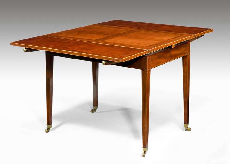 George III period ‘universal’ extending table, exceptionally well designed mahogany table of small proportions when closed, when open capable of seating up to six persons. Quartered top and with boxwood edge stringing.


