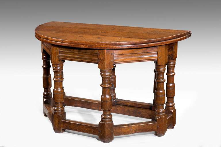 Late 17th century Credence table on massive baluster supports. 

A Credence table is a small side table in the sanctuary of a Christian church which is used in the celebration of the Eucharist.

With restorations.

