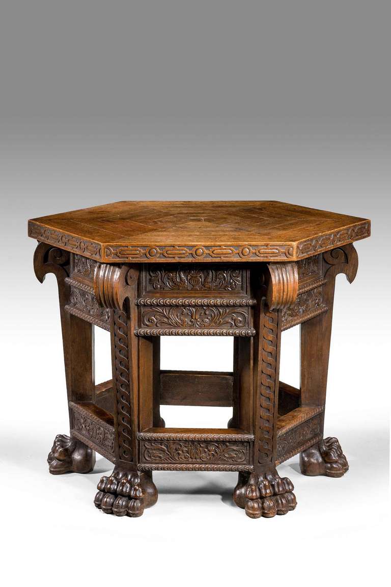 A most unusual oak hexagonal centre table, mid-19th century Italian, the top of a wonderful mature colour and patination, very strong design with shaped and well carved legs with vigorously carving to the feet.

