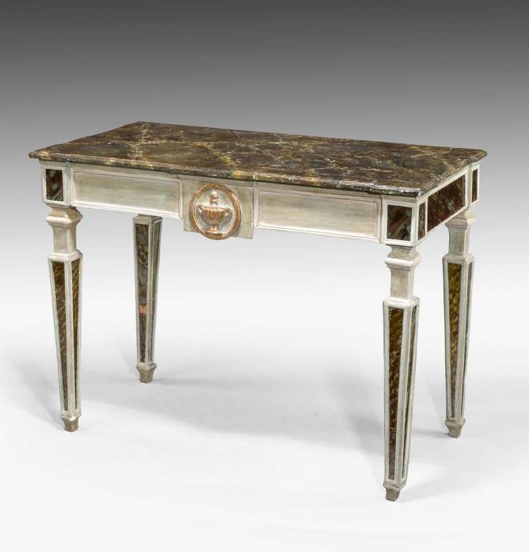 An Italian painted faux marble pier table, with gilded urn decoration to the freeze, the design circa 1770, the table made in the early 20th century.

  
