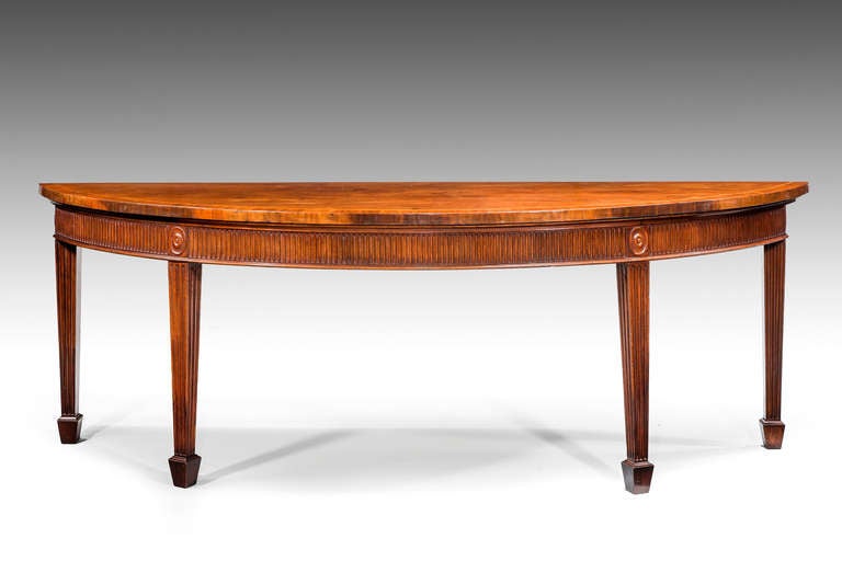 A very fine George III period mahogany elliptical Serving Table, the top cross banded, the freeze with finely executed arcaded decoration, square tapering supports matching the top terminating in block feet. Excellent overall condition and patina,