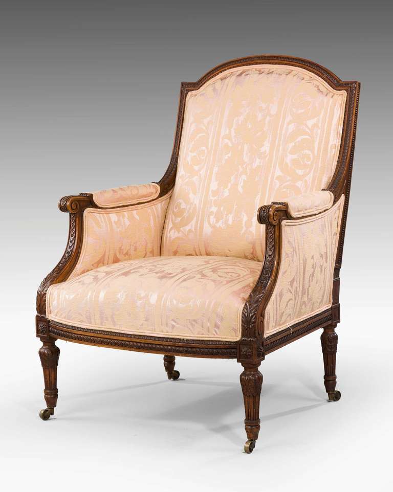 A well carved beech framed Bergere, the continuous carved frame with flowers and foliage.

A bergère is an enclosed upholstered French armchair (fauteuil) with an upholstered back and armrests on upholstered frames. The seat frame is