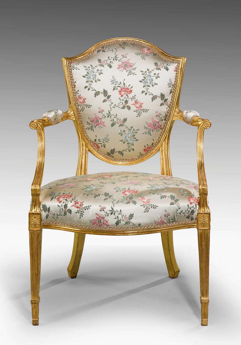A fine pair of George III period giltwood Elbow chairs, the swept arms with roundels over short flared block sections, square incised tapering supports with block sections.

RR.