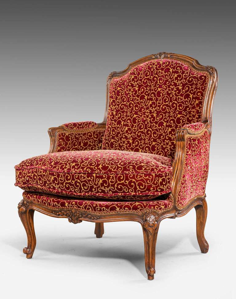 A good oak carved Bergere with continuously carved rococo frame and supports, now covered in French silk.

A Bergère is an enclosed upholstered French armchair (fauteuil) with an upholstered back and armrests on upholstered frames. The seat frame