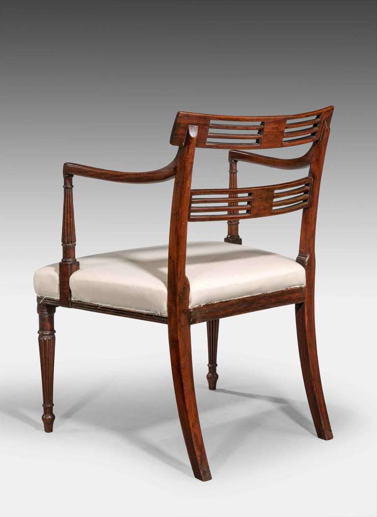 An elegant pair of George III period mahogany elbow chairs, the facades and supports with finely reeded carving, excellent overall condition.

RR.