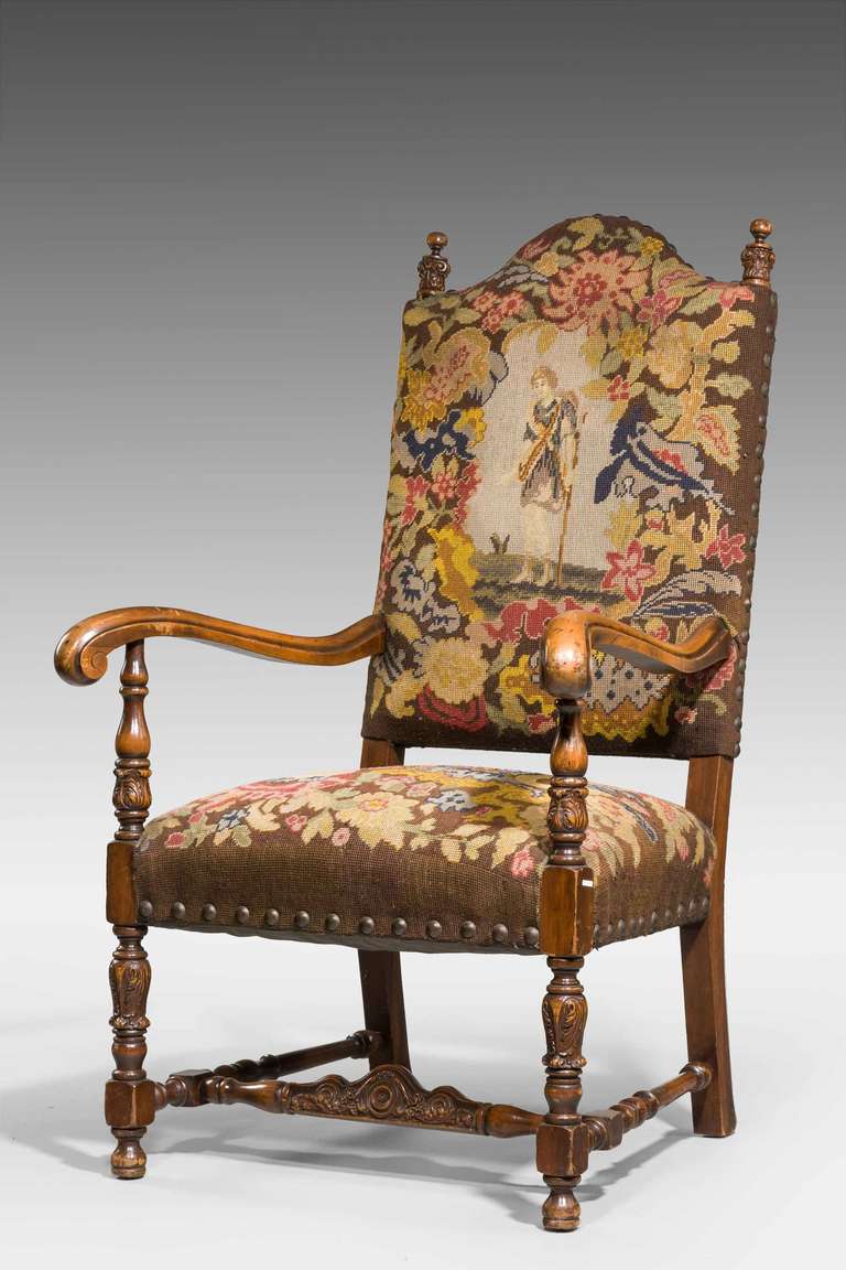 19th century walnut framed chair of late 17th century design, the supports and cross stretchers with elaborate carving, 19th century tapestry upholstery, basically in fine condition.

RR.