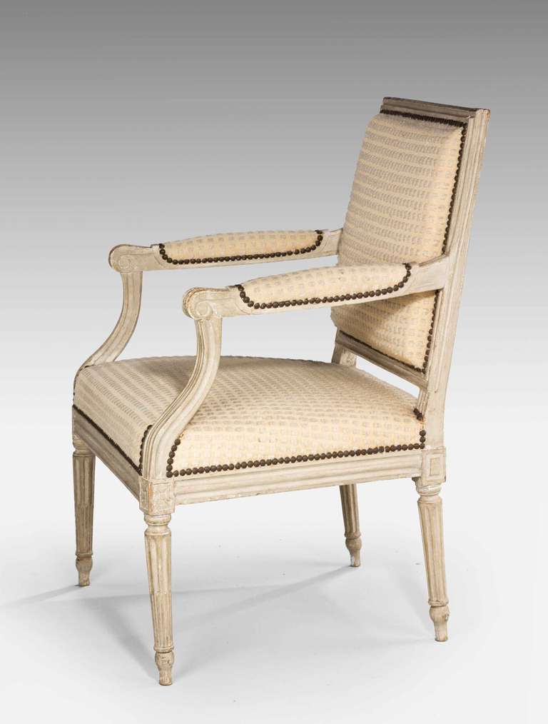 Louis XVI period painted beech fauteuil armchair with reeded decoration, the paintwork now some what tired.

