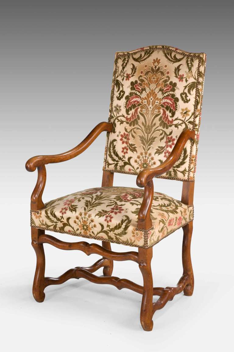 Pair of beechwood 17th century design armchairs of sturdy construction, the shaped supports with wavy cross stretcher.

RR.