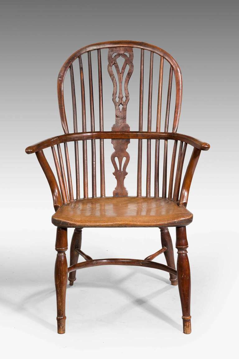 Mid-19th century yew tree windsor chair, crinoline stretcher with some old age cracks to the seat.

The windsor chair is established as one of the great classics of English country furniture. They were made by village craftsmen to traditional