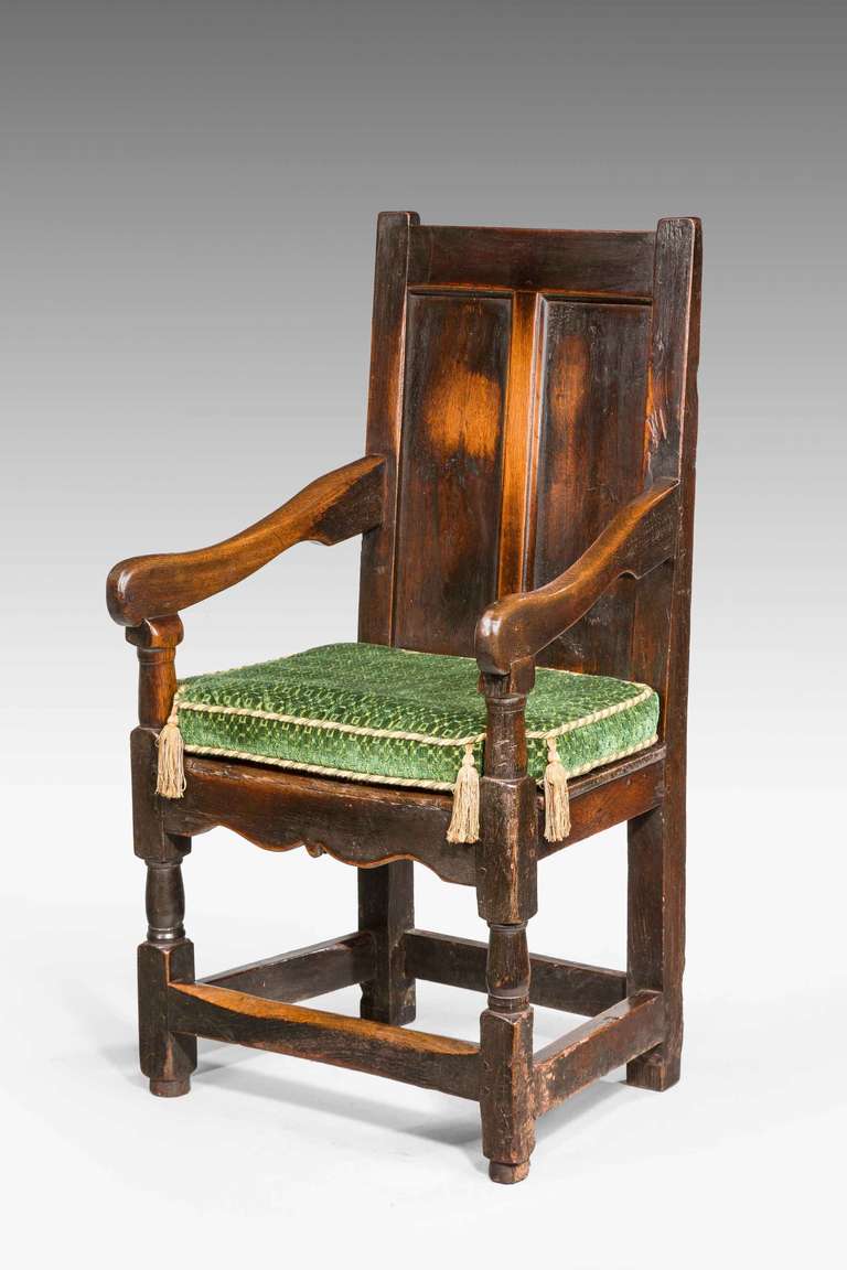 Early 18th century oak armchair of fairly massive construction, excellent color and patina.

RR.