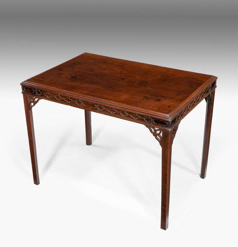 Chippendale period mahogany silver table with a blind fret border with lozenge carving on square section supports with delicately carved corner brackets.

RR.