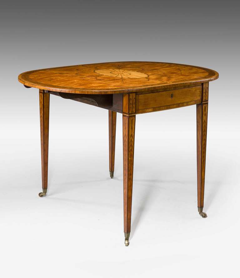 A finely figured late 18th century satinwood pembroke table, the top with a central radiating contrasting fan. Overall rosewood crossbanding on finely veneered tapering square supports.

