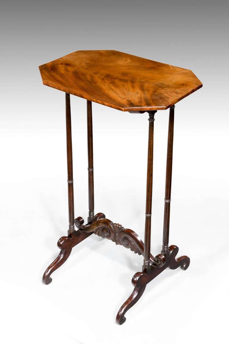 An elegant George III period end table, the octagonal top over very slender turned supports with finely carved under carriage terminating in sledge bases.

RR