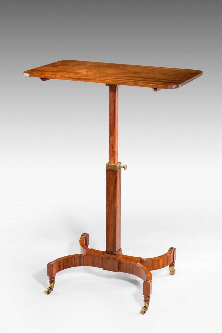 A good Regency period reading/writing table, the adjustable top over a square section, the base supports very well crossbanded on the top and inside the column, the original mechanism capable of being lifted vertically and the top capable of being