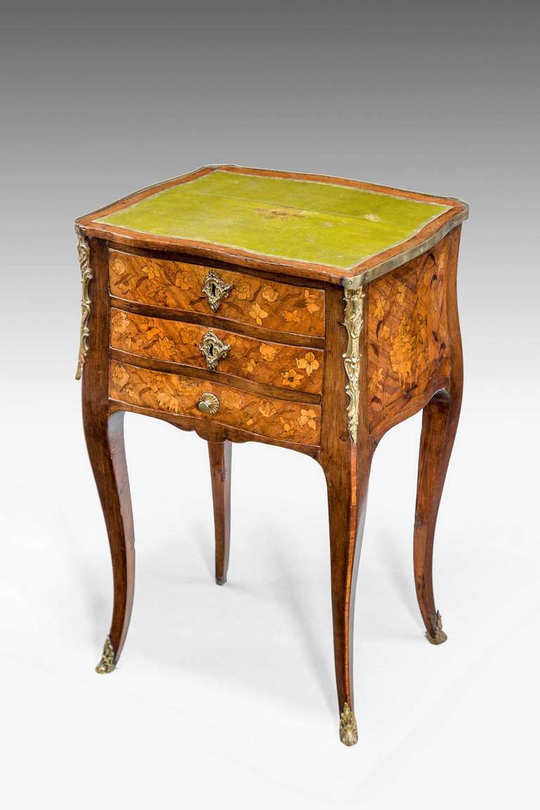 A fine late 19th-century Kingwood three drawer Night Table, parquetry and marquetry of particularly pretty soft form on gentle tapering supports, with original inset leather top.
