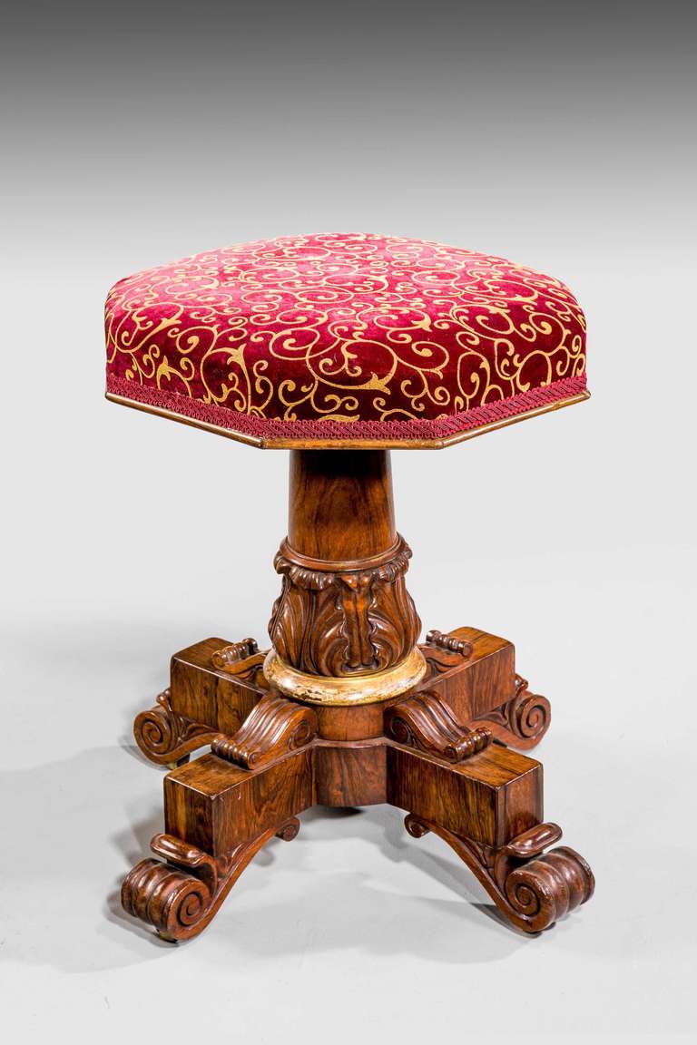 A good Regency period rosewood and parcel gilt adjustable Stool, the four section supports with crisply carved anthemion leaf decoration, the feet of scrolled form terminating in a hip

