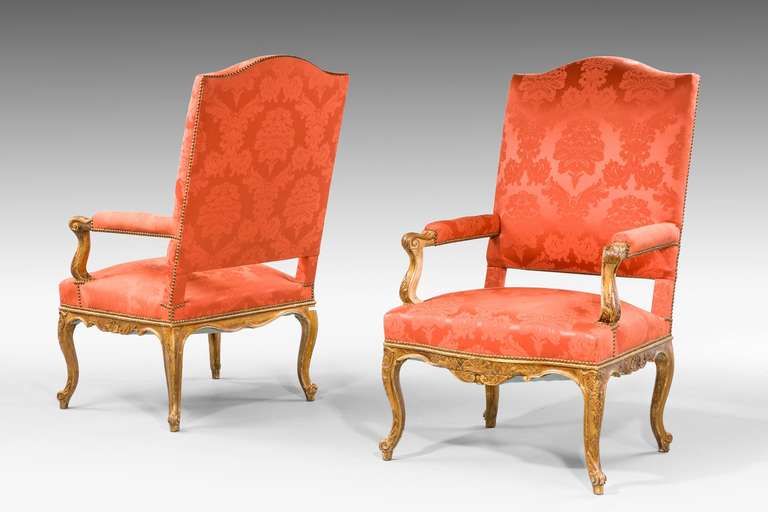 Pair of Régence style gilt wood Chairs, the surfaces somewhat worn but retaining original gilding.
