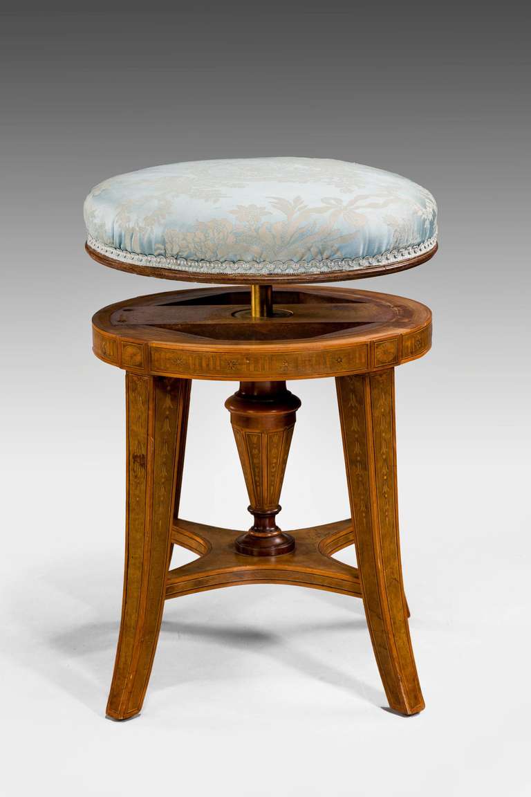 A good adjustable stool with fine marquetry decoration dating from the end of the 19th century.
