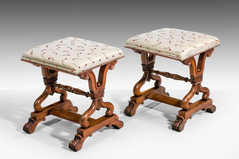 Pair of Regency period Stools with elaborate supports over a 'H' section base