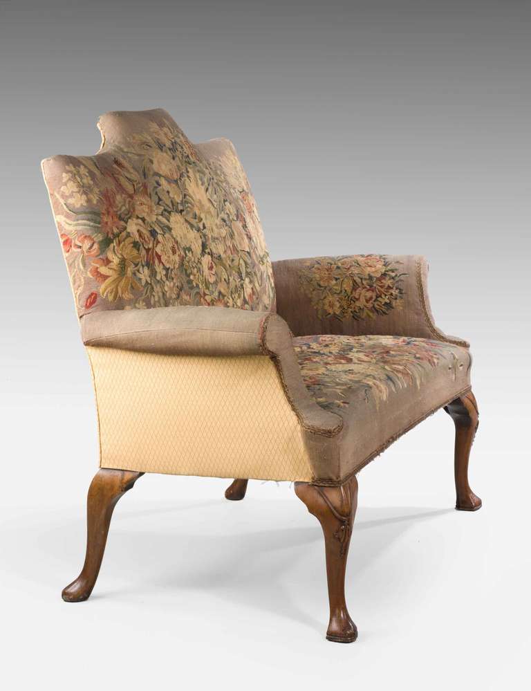 A Queen Anne design walnut two seater Sofa on cabriole supports, the tapestry upholstery now some what tired and in poor condition.

RR