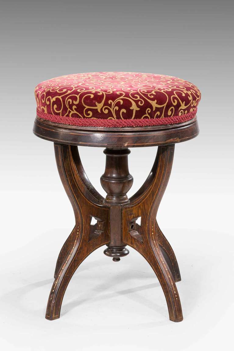 Late 19th century rosewood revolving piano stool, hare bell inlay to the supports with mother of pearl.