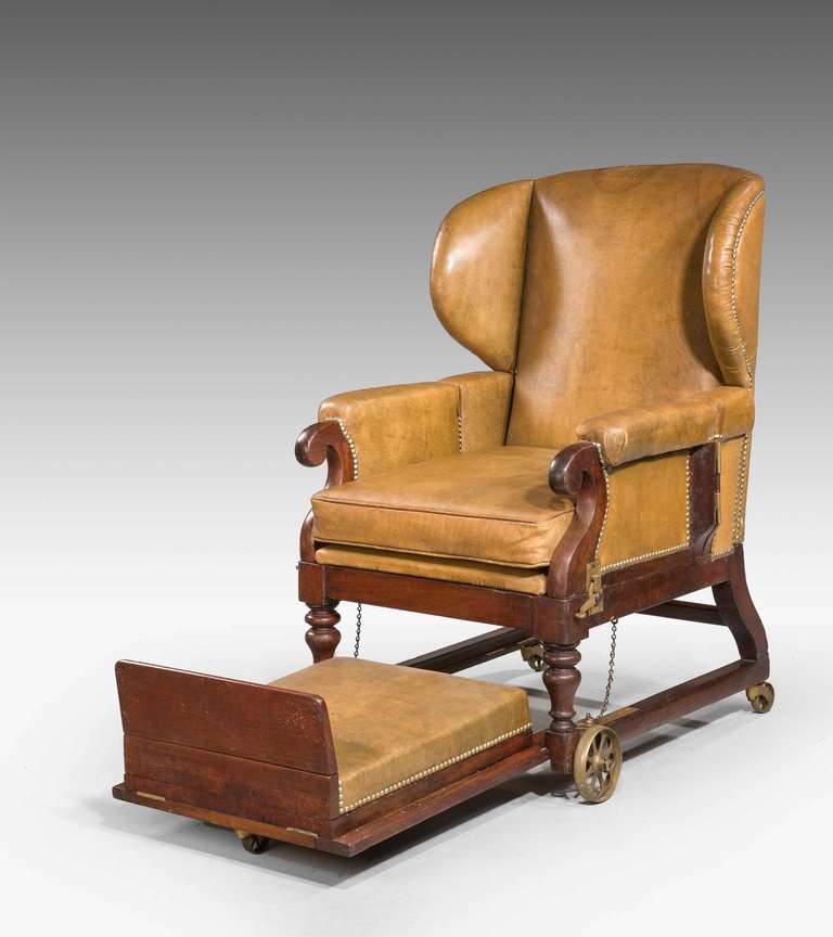 19th Century Invalids Chair with moveable arm rests, reclining back, gout stool on a ratchet all in in fine cows hide. Signed with makers/dealers lable J WARD to the reverse.

The label possibly a dealer's rather than a manufacturer's label.John