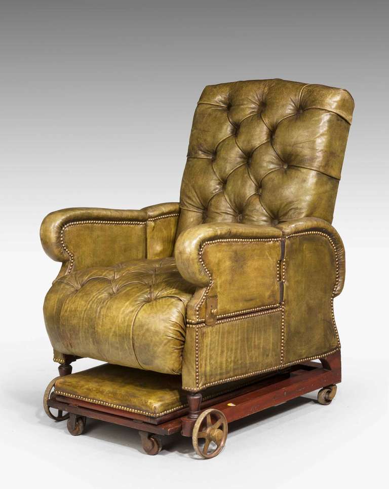 19th century Invalids chair with moveable armrests, reclining back, gout stool on a ratchet all in fine cows hide. 

The Invalids chair is not to be confused with the Bath chair, which is a rolling chaise or light carriage with a folding hood,