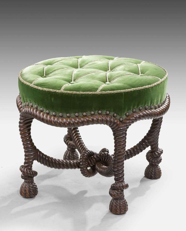 In the manner of Fournier, a fine example of a 19th century writhen mahogany stool the complex intertwined design terminating in tassel feet, upholstered in green velvet.

RR.