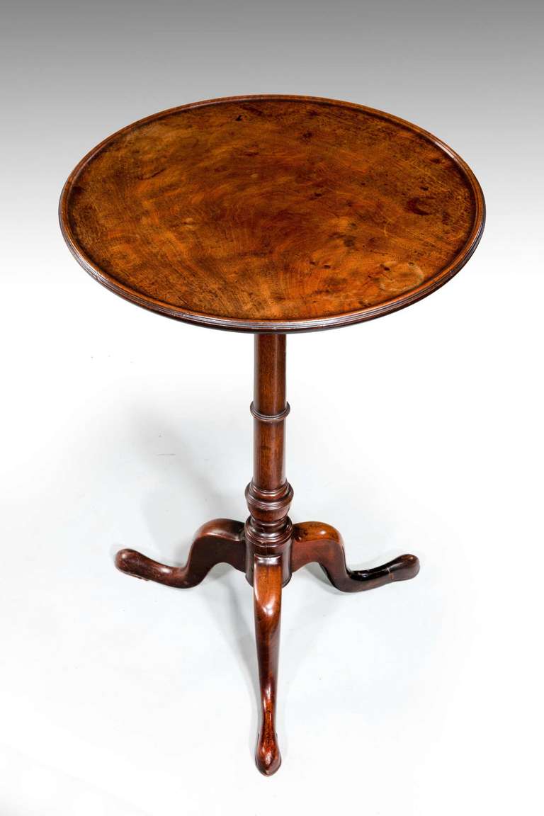 George III period mahogany Tripod Table on a well turned stem, the top highly figured and slightly dished