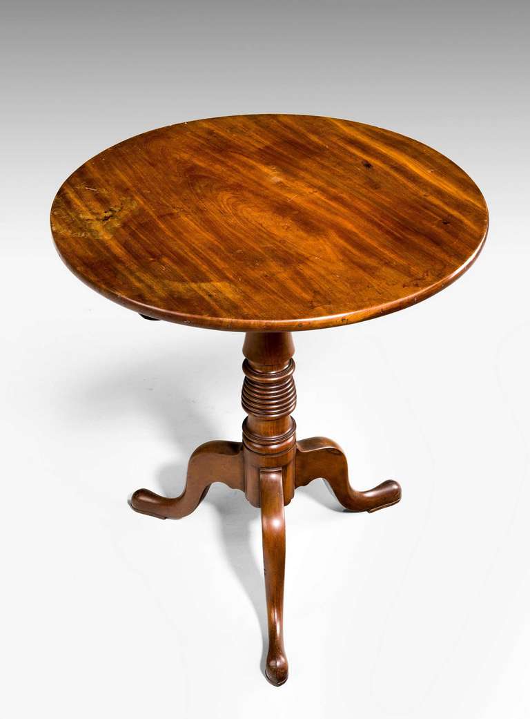 An attractive George III period circular tilt table with a beehive centre section, tripod support ending on pad feet; the top well figured.

RR.