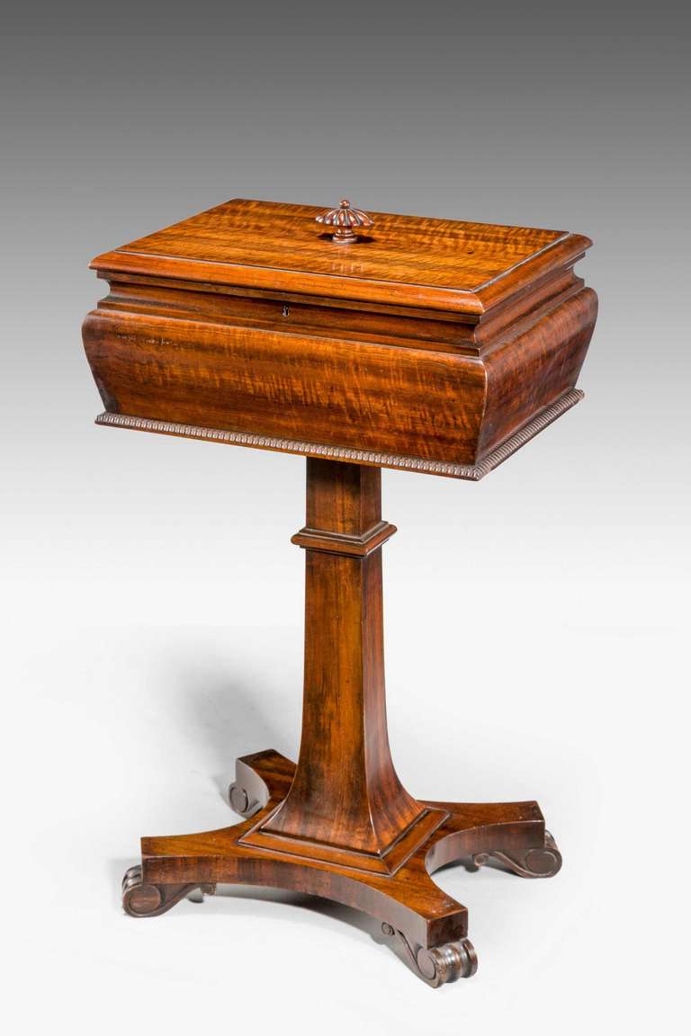 Regency period well figured Work Table, the square section rounded top supported on a flared upright terminating on a platform base with four scroll feet

RR