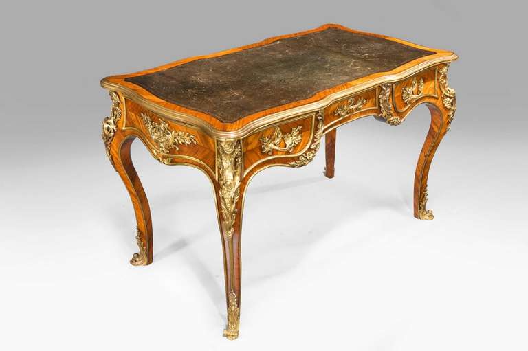 A quite exceptional Kingwood Writing table in the French taste by Gillows of Lancaster. English gilt bronze mounts of the finest quality, now somewhat tired but retaining their original surfaces. Gillows at its finest, signed on the centre drawer