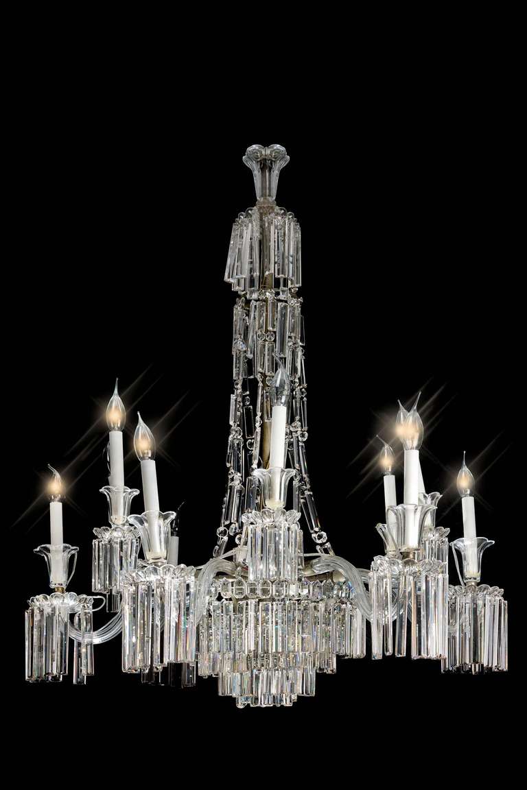 An elegant cut-glass Chandelier, the fine quality faceted drops below cut holders with tulip shape supports, the glass of particularly good quality.