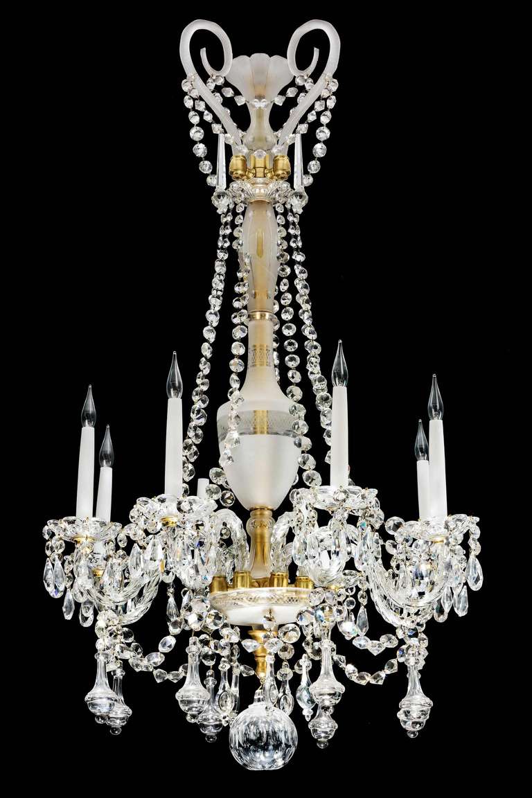 A fine quality mid-19th century cut and etched glass chandelier, the vase and flared central section with acid etched decoration, the shaped arms with beautifully cut and elaborate pear shaped drops.

RR.