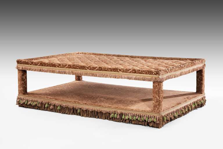 A most unusual low table of French manufacture, entirely upholstered, the top deep buttoned.
