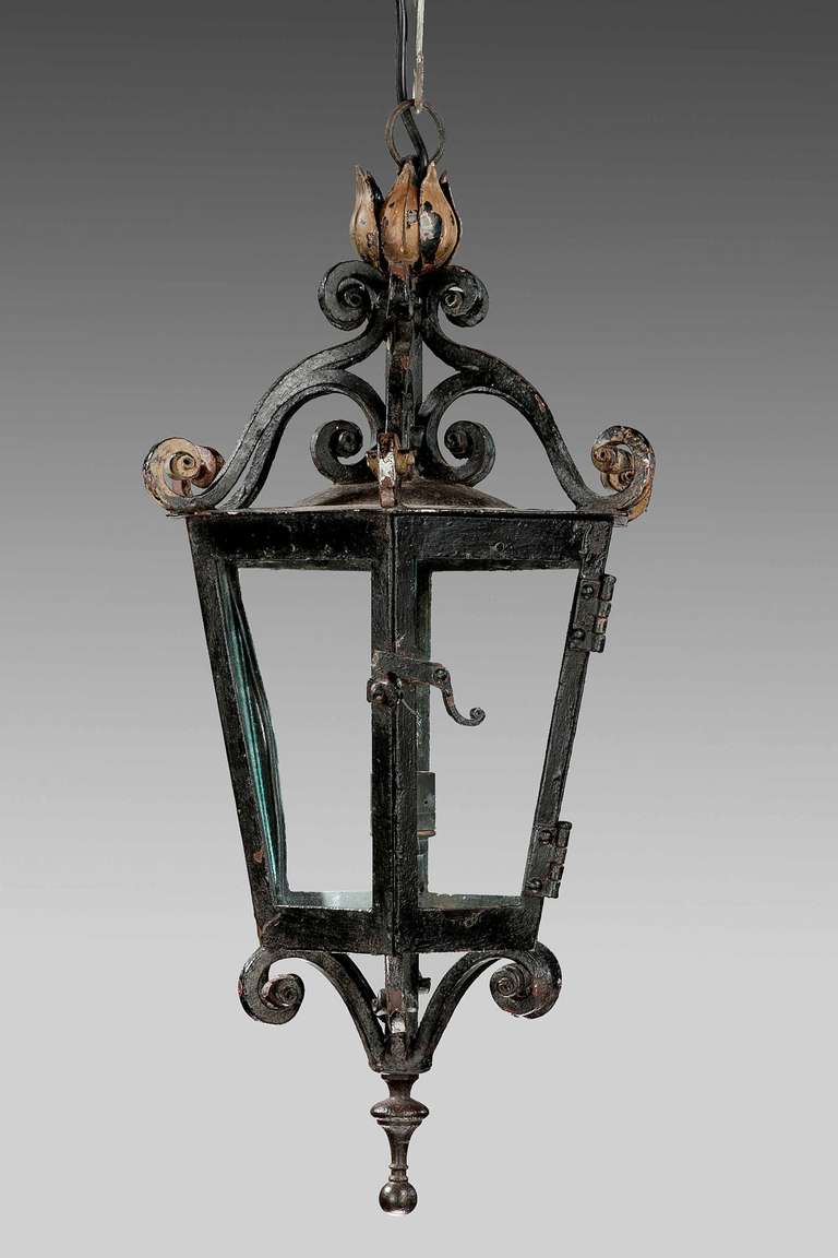 Pair of patinated, cast iron six glass Lantern, the base and top with elaborate scrolls.

RR